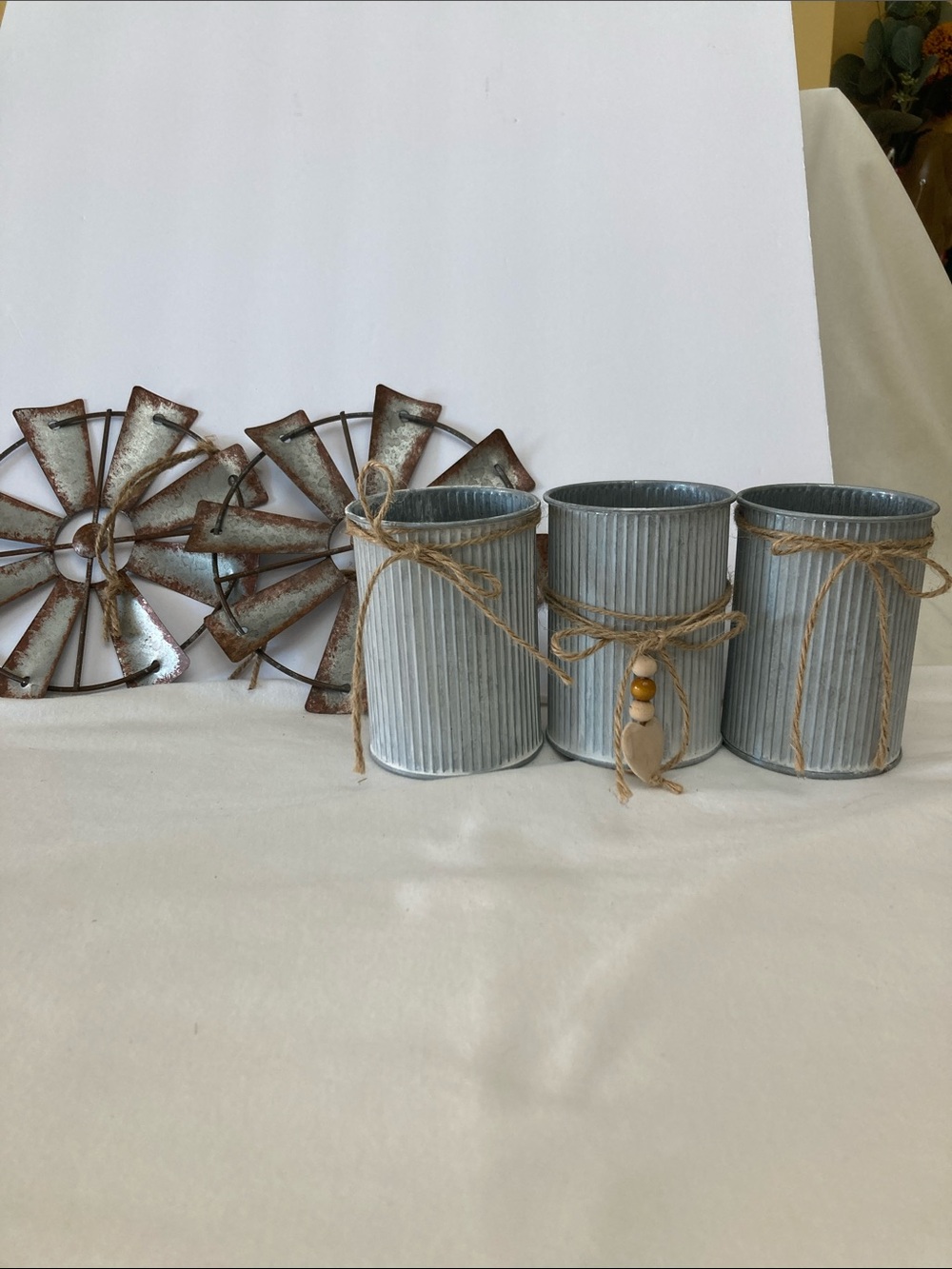 Bundle of galvanized decorative pieces- cans and windmills.